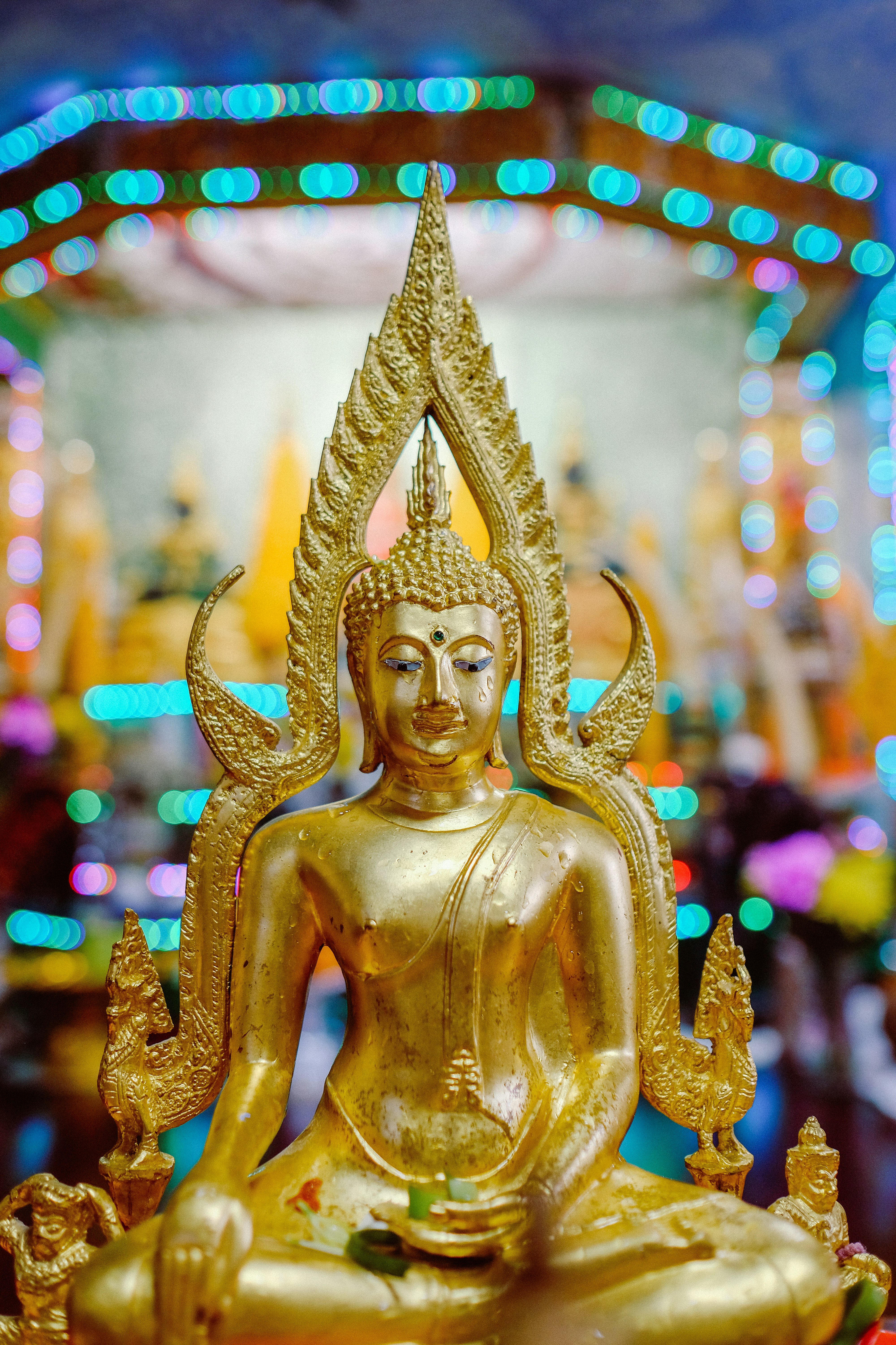gold buddha figurine in tilt shift lens